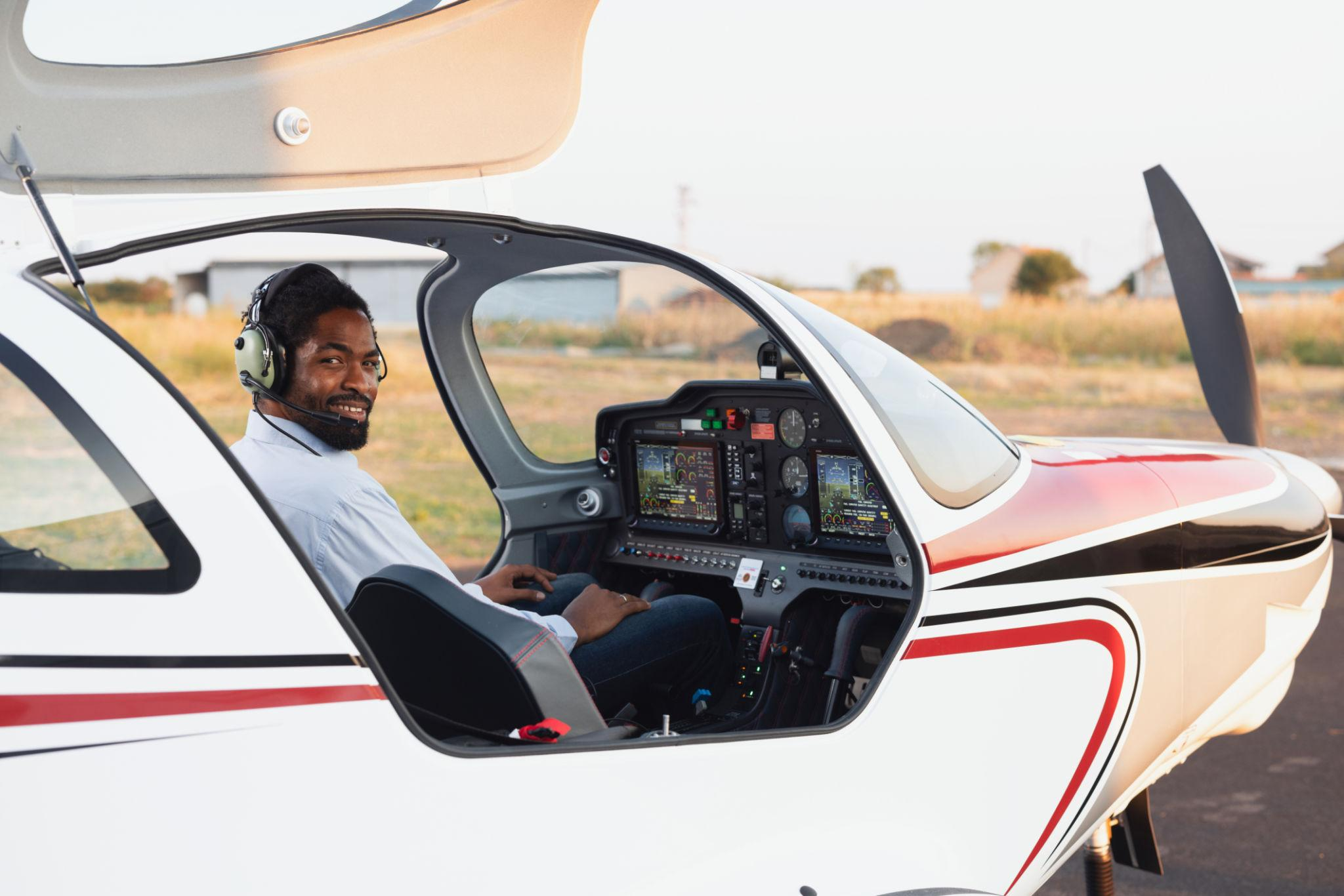 Pilot seated in a training aircraft cockpit